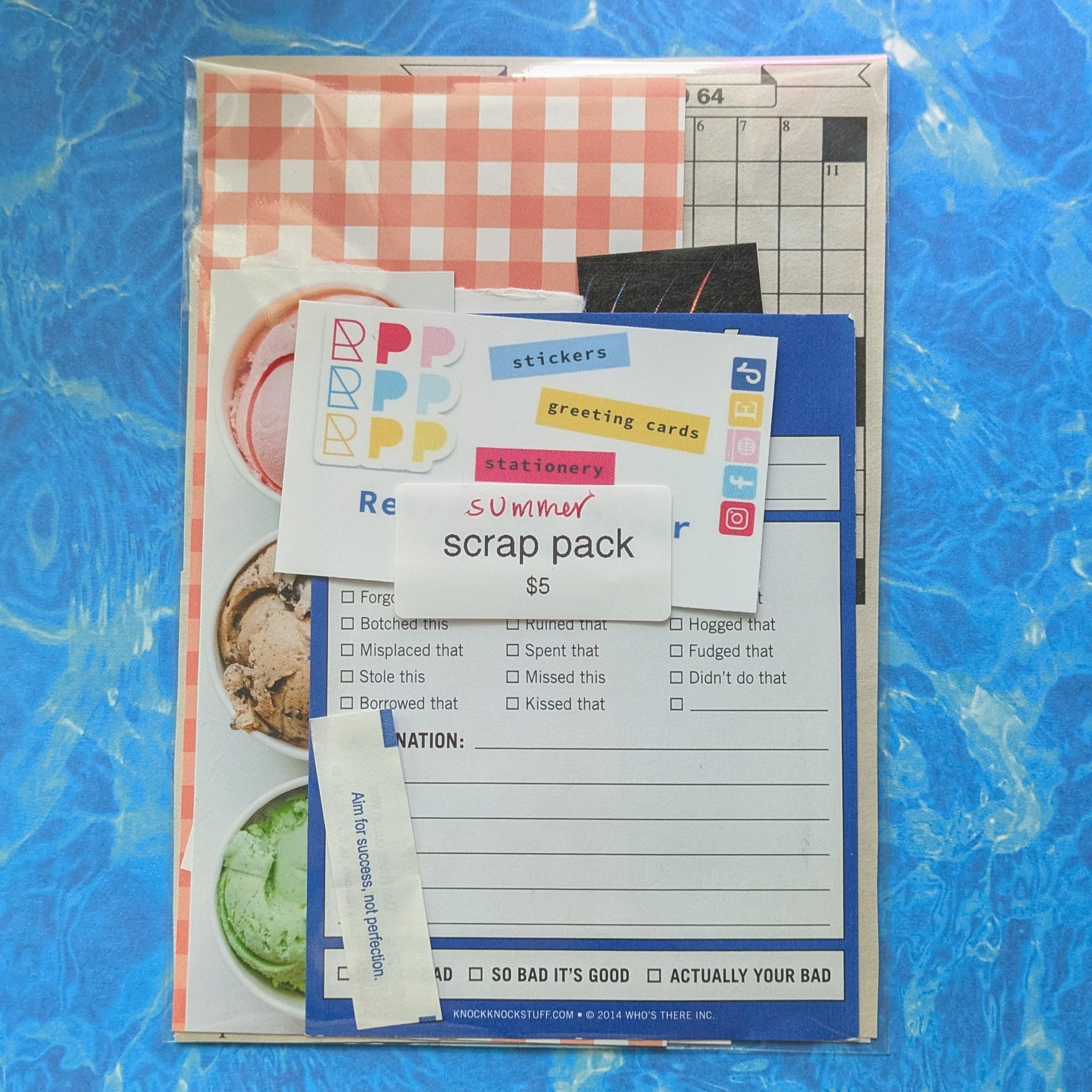 Scrapbooking supplies on a blue surface